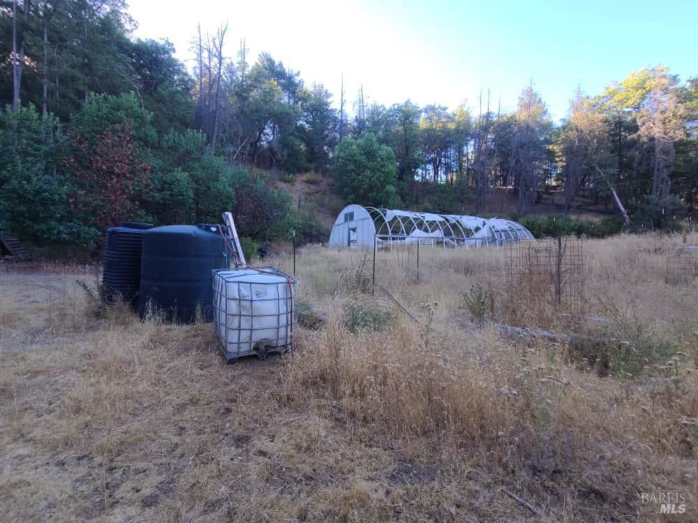 28990 Eel River Ranch Road Covelo, CA 95428 - Photo 24 of 31 a view of a chairs and table in the back yard