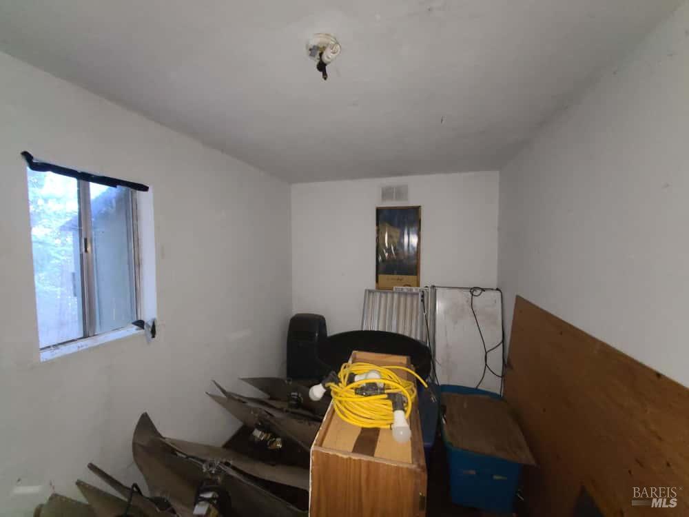 28990 Eel River Ranch Road Covelo, CA 95428 - Photo 30 of 31 a view of workspace with wooden floor windows cabinet and mirror