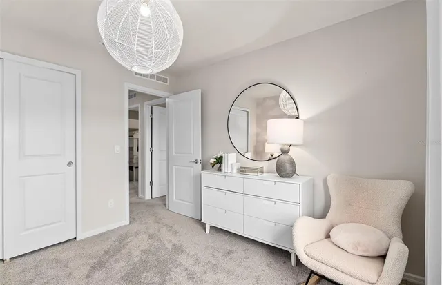 a room with furniture a mirror and a window