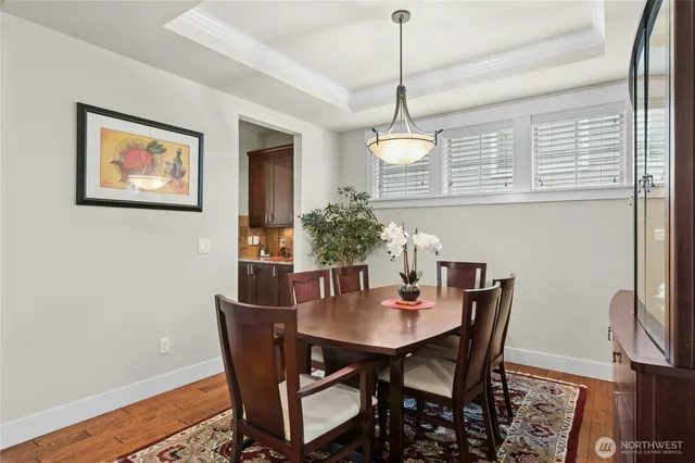 a view of a dining room with furniture window and wooden floor