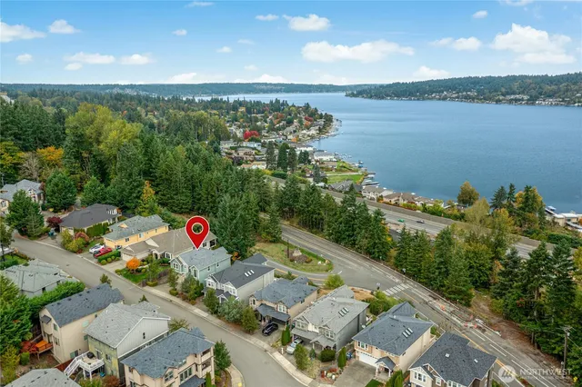 an aerial view of a house with a lake view
