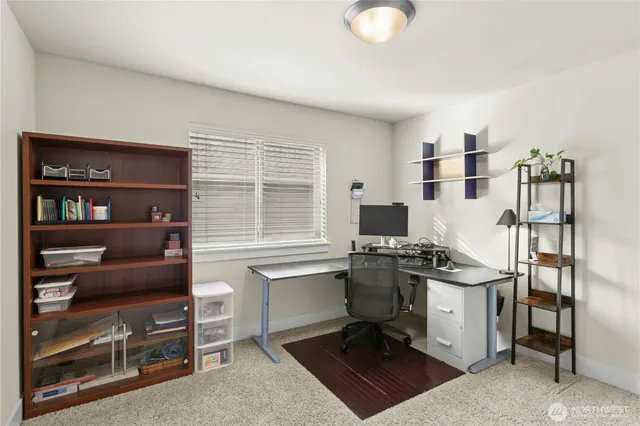 a view of a workspace with furniture