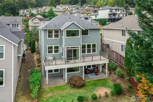an aerial view of a house with balcony and garden