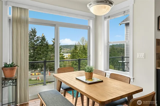 a view of a dining room with furniture window and outside view