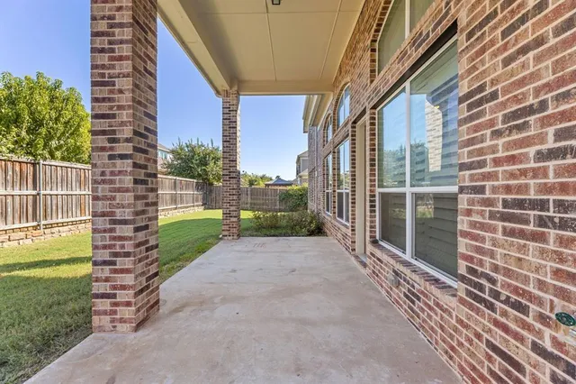 a view of a backyard with a small garden