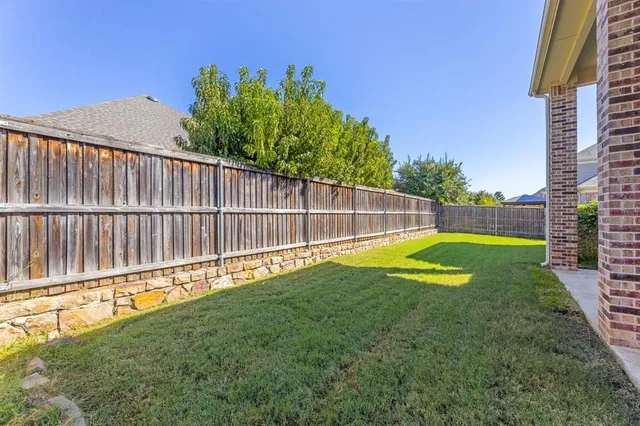 a view of a house with a yard and plants