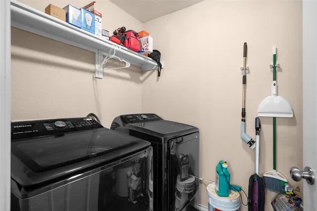 a utility room with dryer and washer