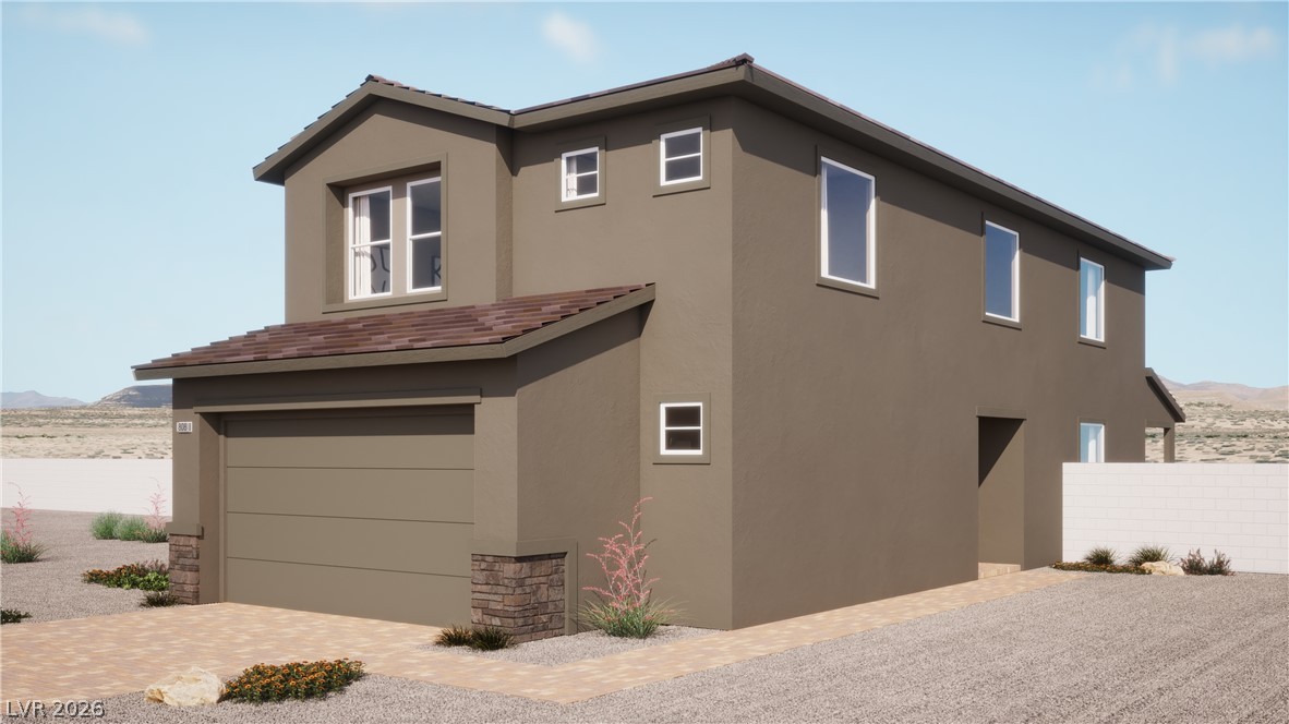 1731 Strada Nathan Henderson, NV 89011 - Photo 1 of 3 Modern desert dwelling with attached garage and gravel landscaping.