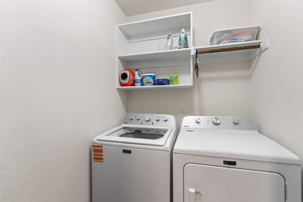 300 Copper Switch Drive Anna, TX 75409 - Photo 24 of 26 Hall Laundry room with shelving