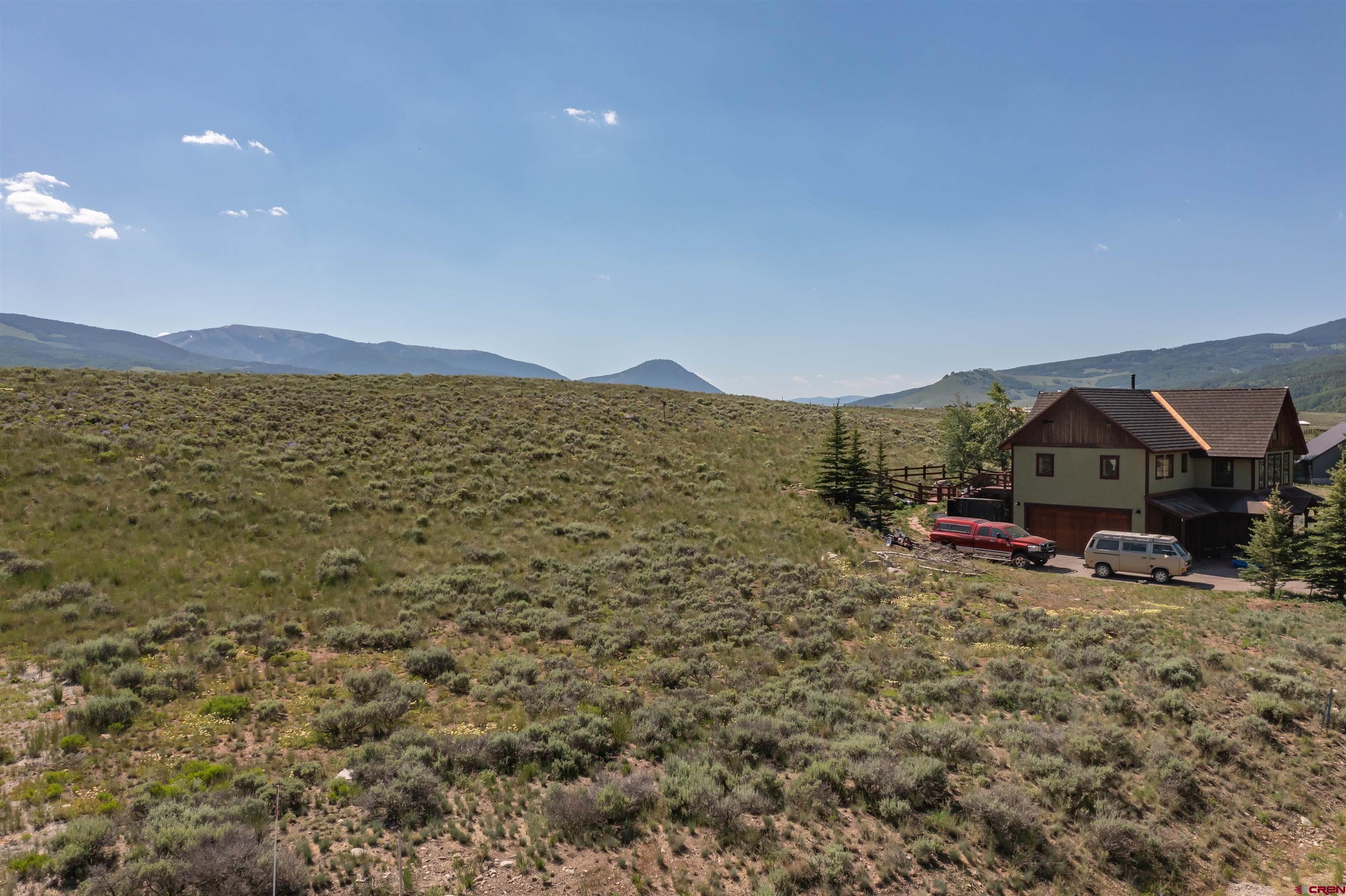 365 Larkspur Loop Crested Butte, CO 81224 - Photo 4 of 20 a view of a town with mountains in the background