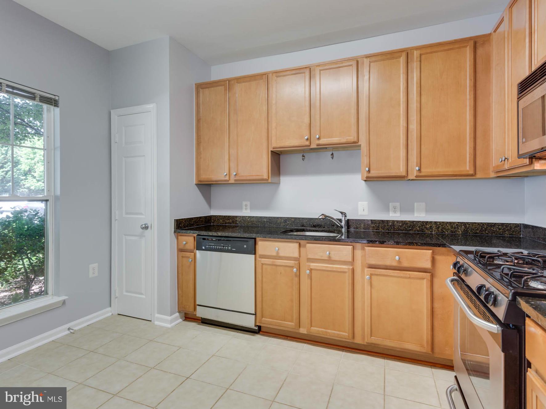 1511 North Point Drive, Unit 104 Reston, VA 20194 - Photo 11 of 28 Spacious Kitchen with SS Appl and Granite Counters