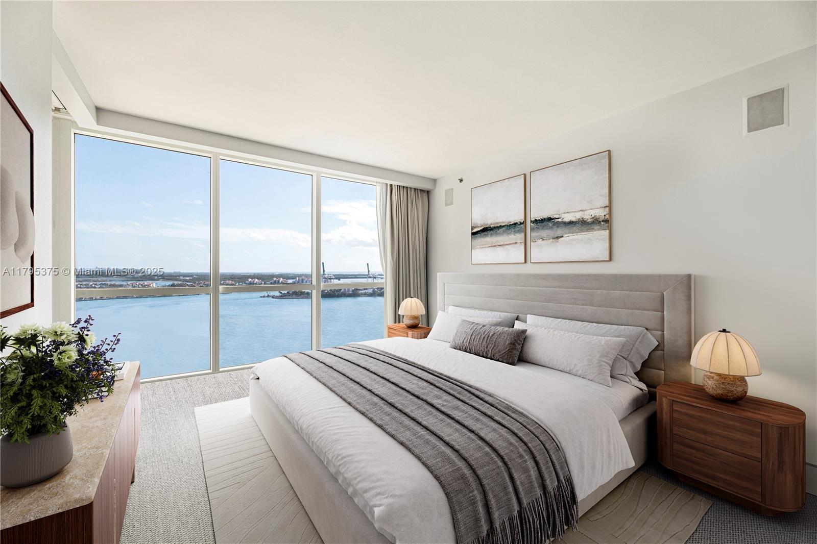 450 Alton Road, Unit 2303 Miami Beach, FL 33139 - Photo 17 of 51 a bedroom with a large bed and a large window