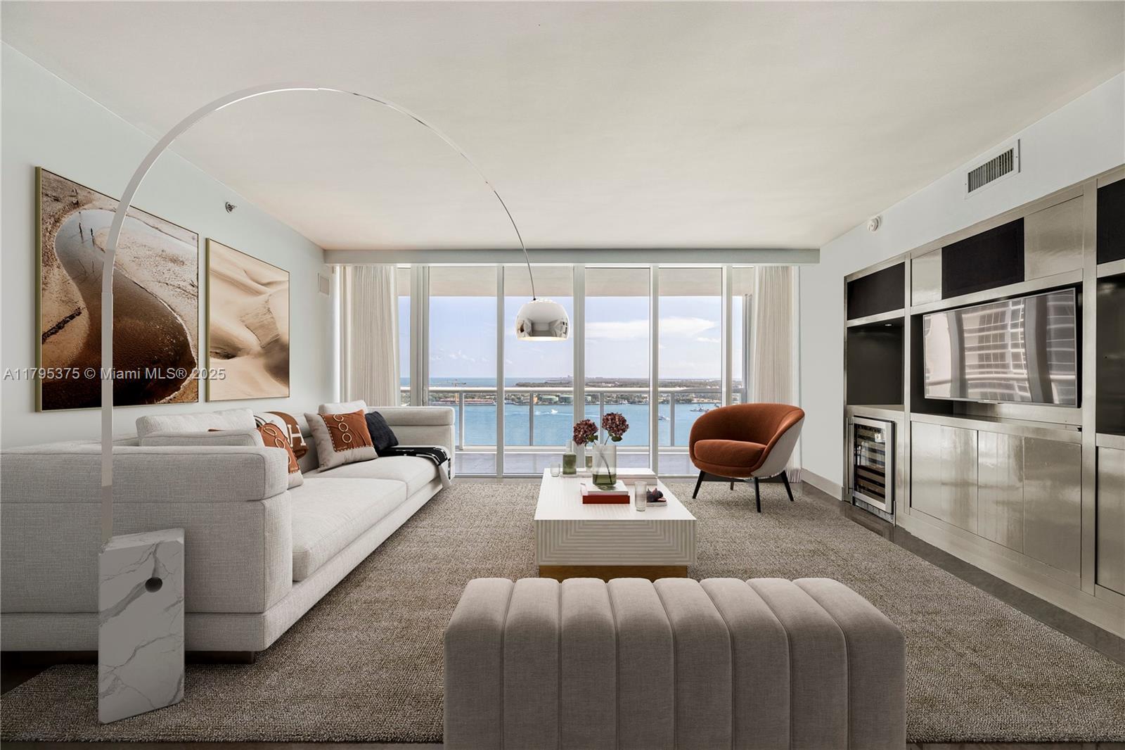 450 Alton Road, Unit 2303 Miami Beach, FL 33139 - Photo 22 of 51 a bedroom with furniture and a large window