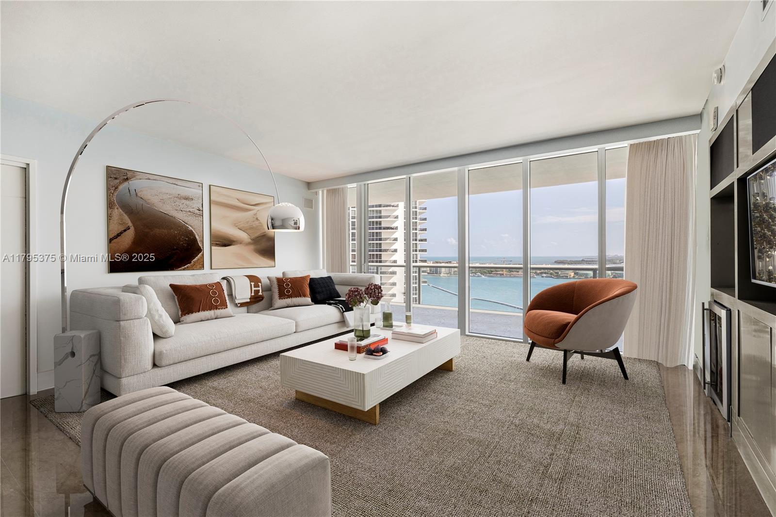 450 Alton Road, Unit 2303 Miami Beach, FL 33139 - Photo 4 of 51 a living room with furniture and a flat screen tv