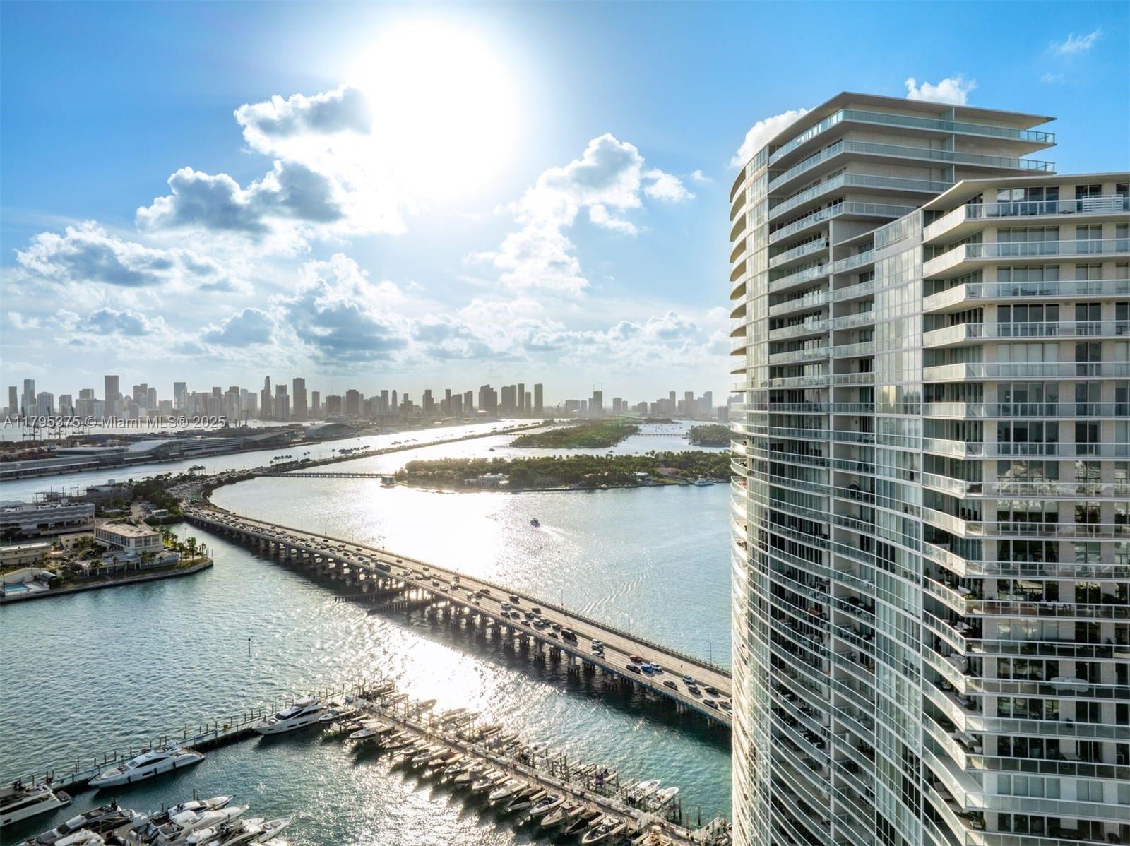 450 Alton Road, Unit 2303 Miami Beach, FL 33139 - Photo 5 of 51 a view of a swimming pool with a lake view