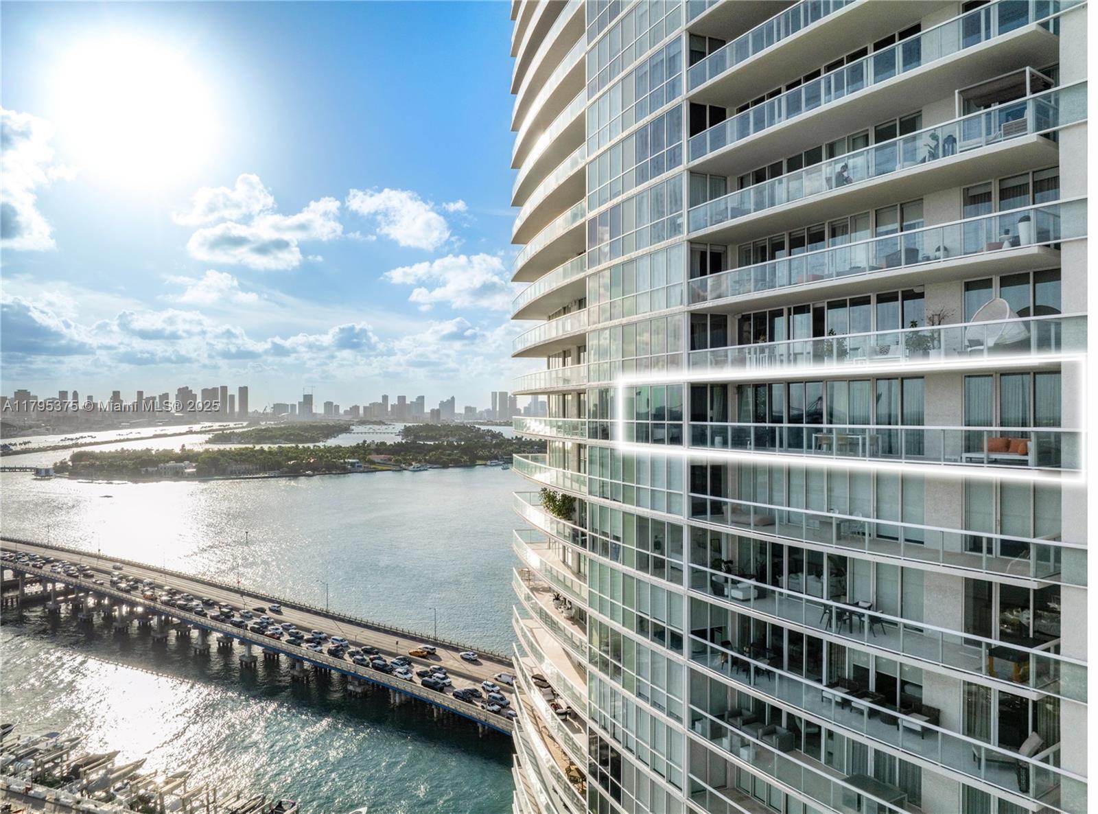 450 Alton Road, Unit 2303 Miami Beach, FL 33139 - Photo 6 of 51 a view of a lake with building in front of it