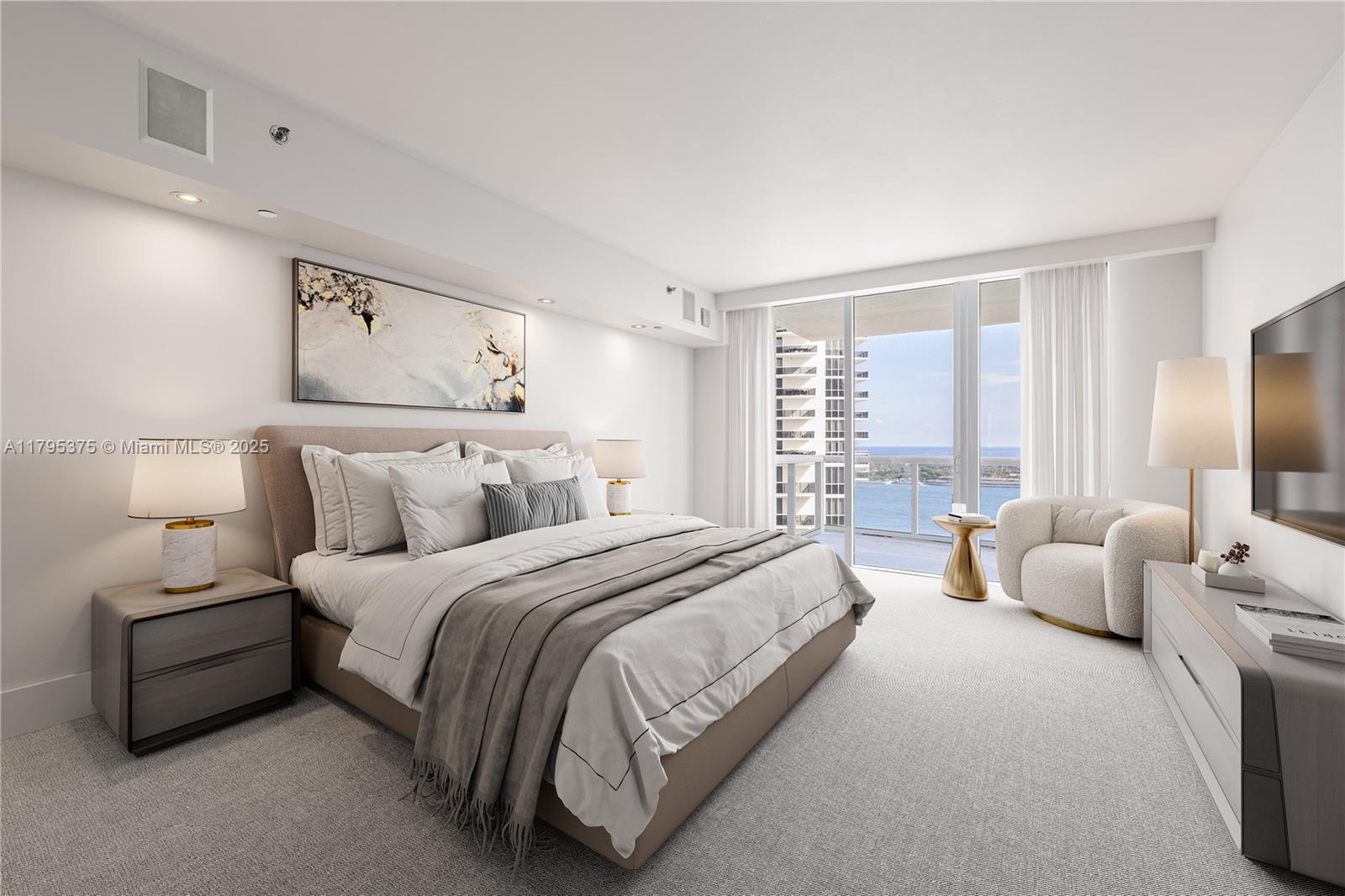 450 Alton Road, Unit 2303 Miami Beach, FL 33139 - Photo 7 of 51 a spacious bedroom with a bed and lamp