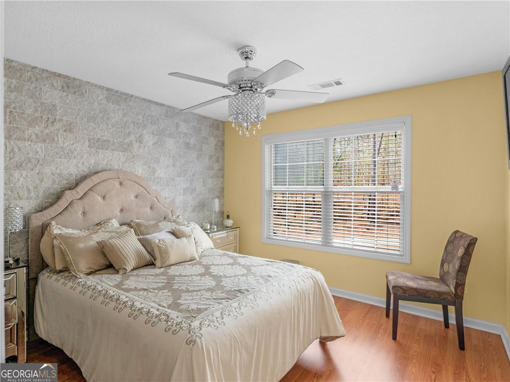 355 Parker Road Covington, GA 30014 - Photo 37 of 60 a large bed sitting in a bedroom next to a window