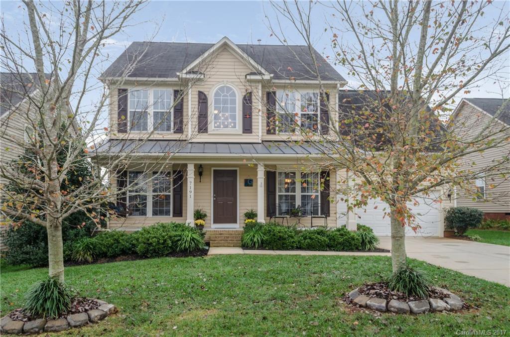 7191 Meyer Road Fort Mill, SC 29715 - Photo 1 of 24 a front view of a house with a yard