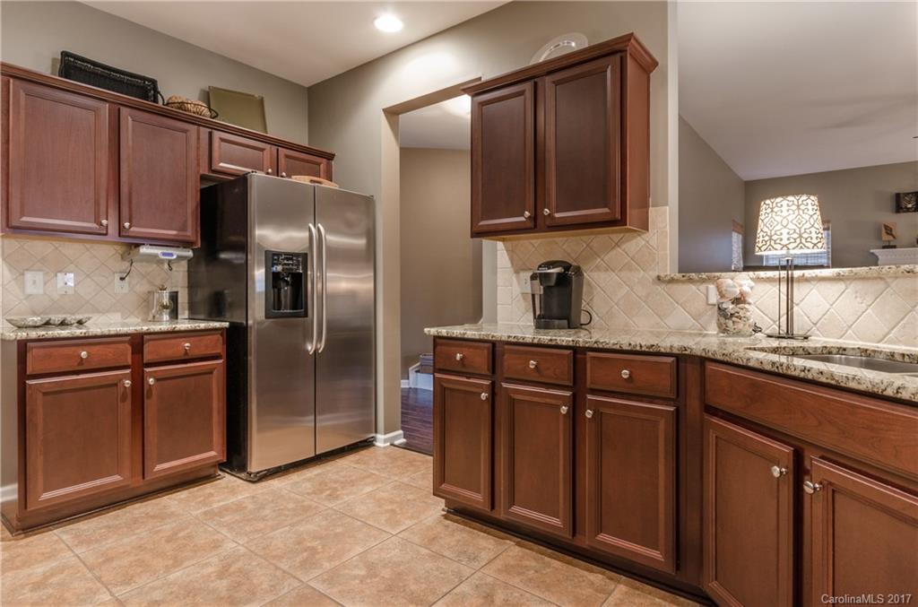 7191 Meyer Road Fort Mill, SC 29715 - Photo 8 of 24 a kitchen with stainless steel appliances granite countertop a refrigerator and a sink