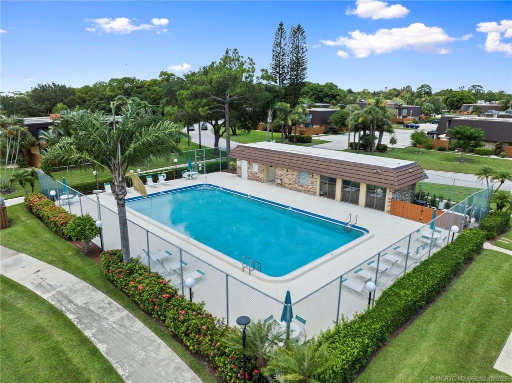 5818 Southeast Windsong Lane Stuart, FL 34997 - Photo 6 of 18 an aerial view of a house with a swimming pool