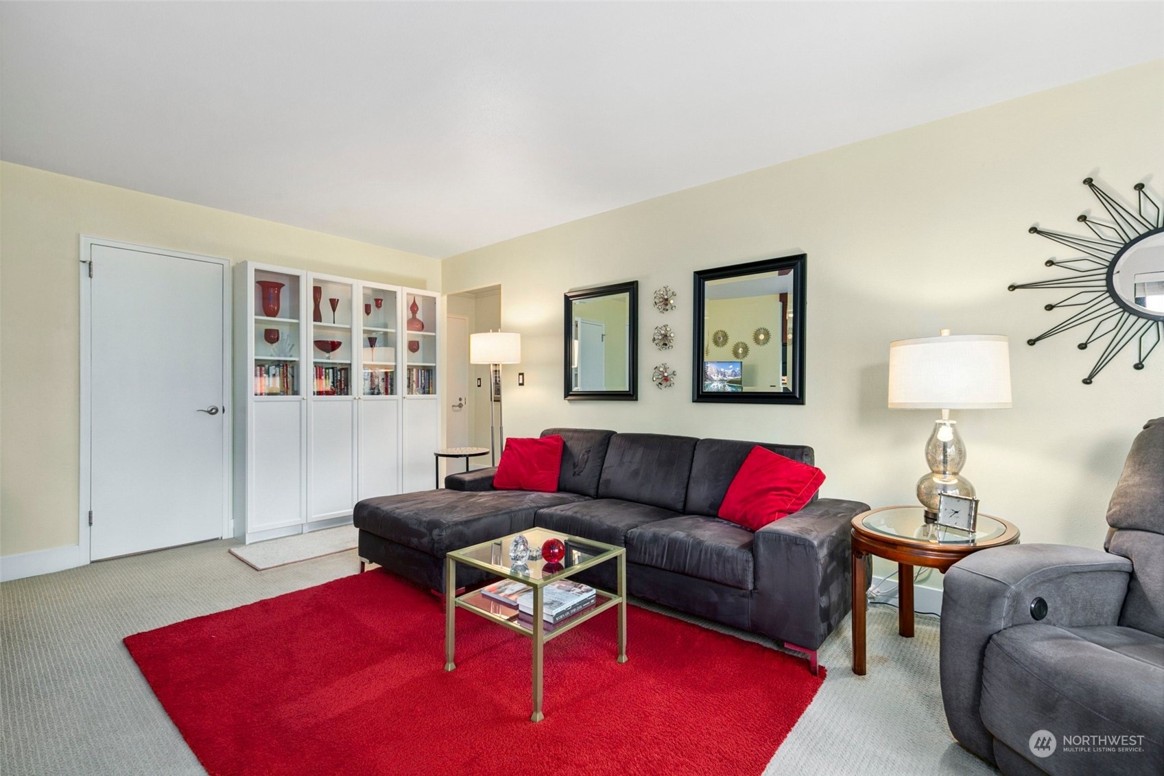 1105 Spring Street, Unit 405 Seattle, WA 98104 - Photo 6 of 26 a living room with furniture and a wooden floor