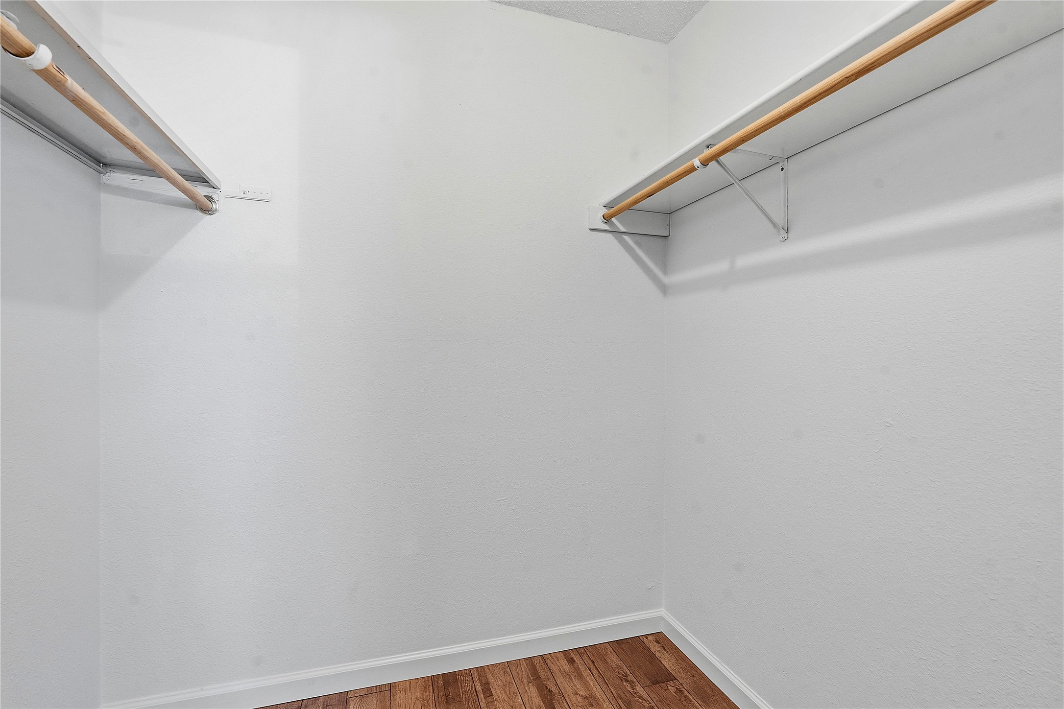 6205 Shadow Bend Austin, TX 78745 - Photo 21 of 31 Ample hanging space and durable flooring offer a functional wardrobe solution.