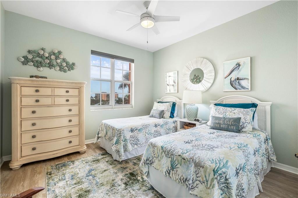 170 Lenell Road, Unit 401 Fort Myers Beach, FL 33931 - Photo 12 of 24 a bedroom with a bed and a window