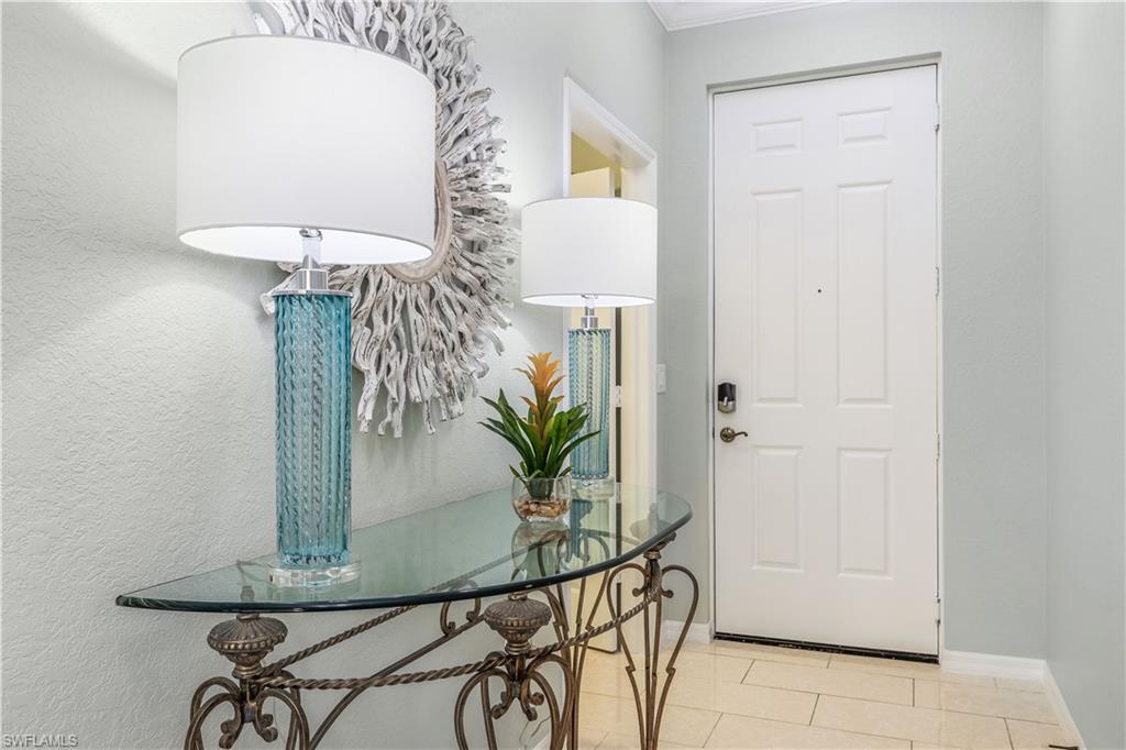 170 Lenell Road, Unit 401 Fort Myers Beach, FL 33931 - Photo 13 of 24 a potted plant sitting on top of a table