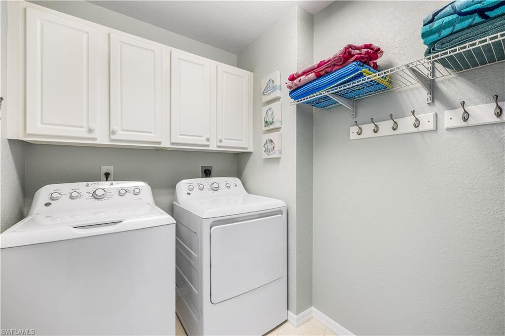 170 Lenell Road, Unit 401 Fort Myers Beach, FL 33931 - Photo 14 of 24 a utility room with dryer and washer