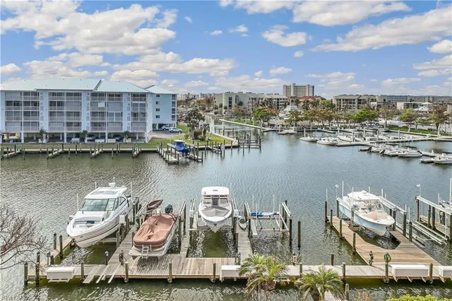 an aerial view of a city with tables and chairs