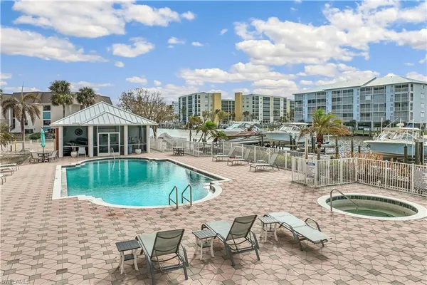 a view of a swimming pool with a patio