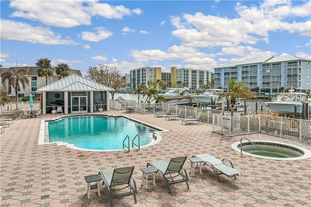 170 Lenell Road, Unit 401 Fort Myers Beach, FL 33931 - Photo 23 of 24 a view of a swimming pool with a patio