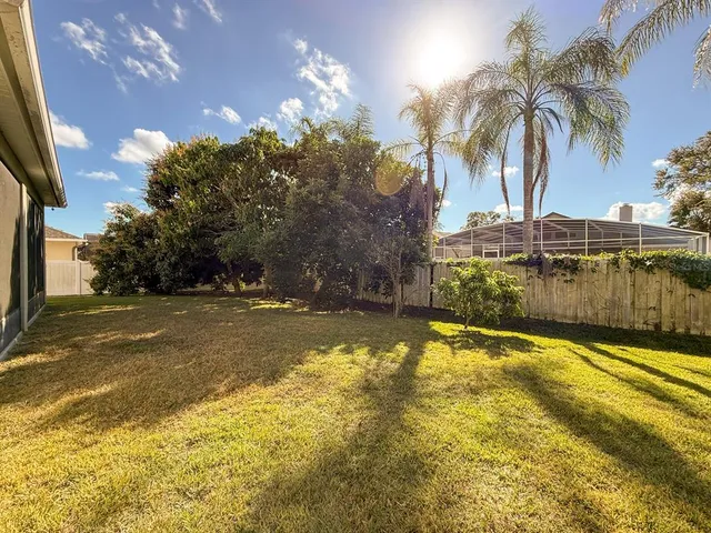 a view of a swimming pool with a patio