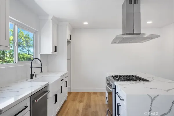 a kitchen with a sink and a window