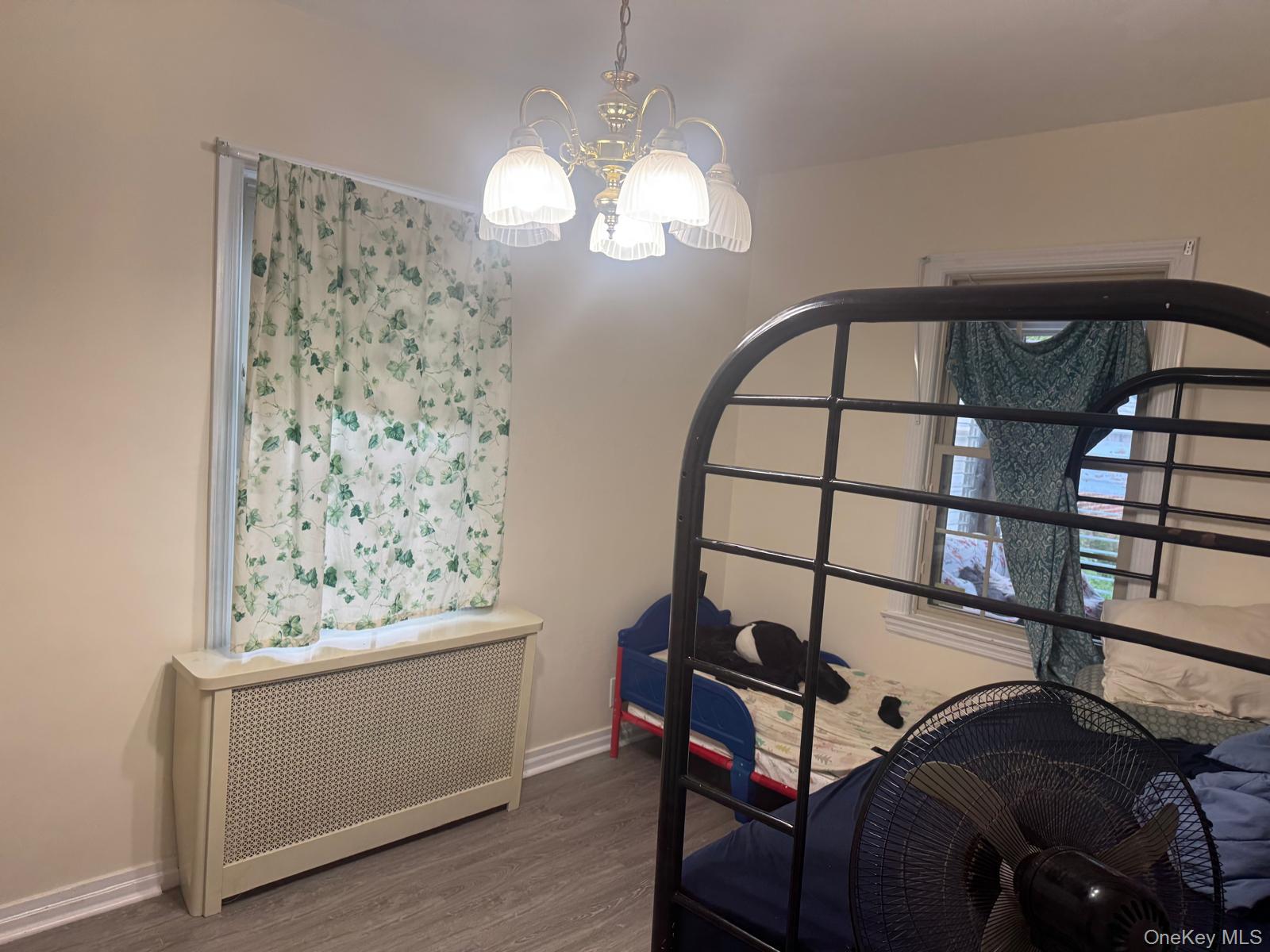 80-23 247th Street Queens, NY 11426 - Photo 14 of 19 a view of a hallway with wooden floor and staircase