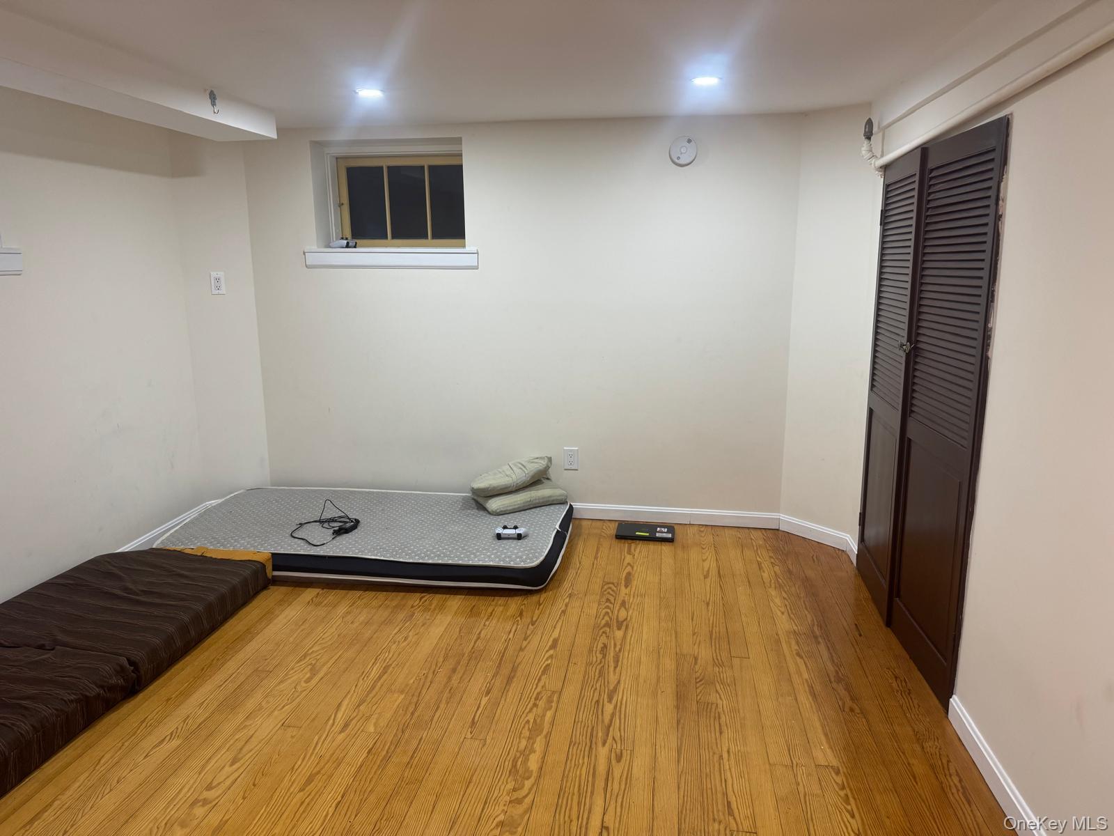 80-23 247th Street Queens, NY 11426 - Photo 17 of 19 a view of a room with wooden floor and pool table