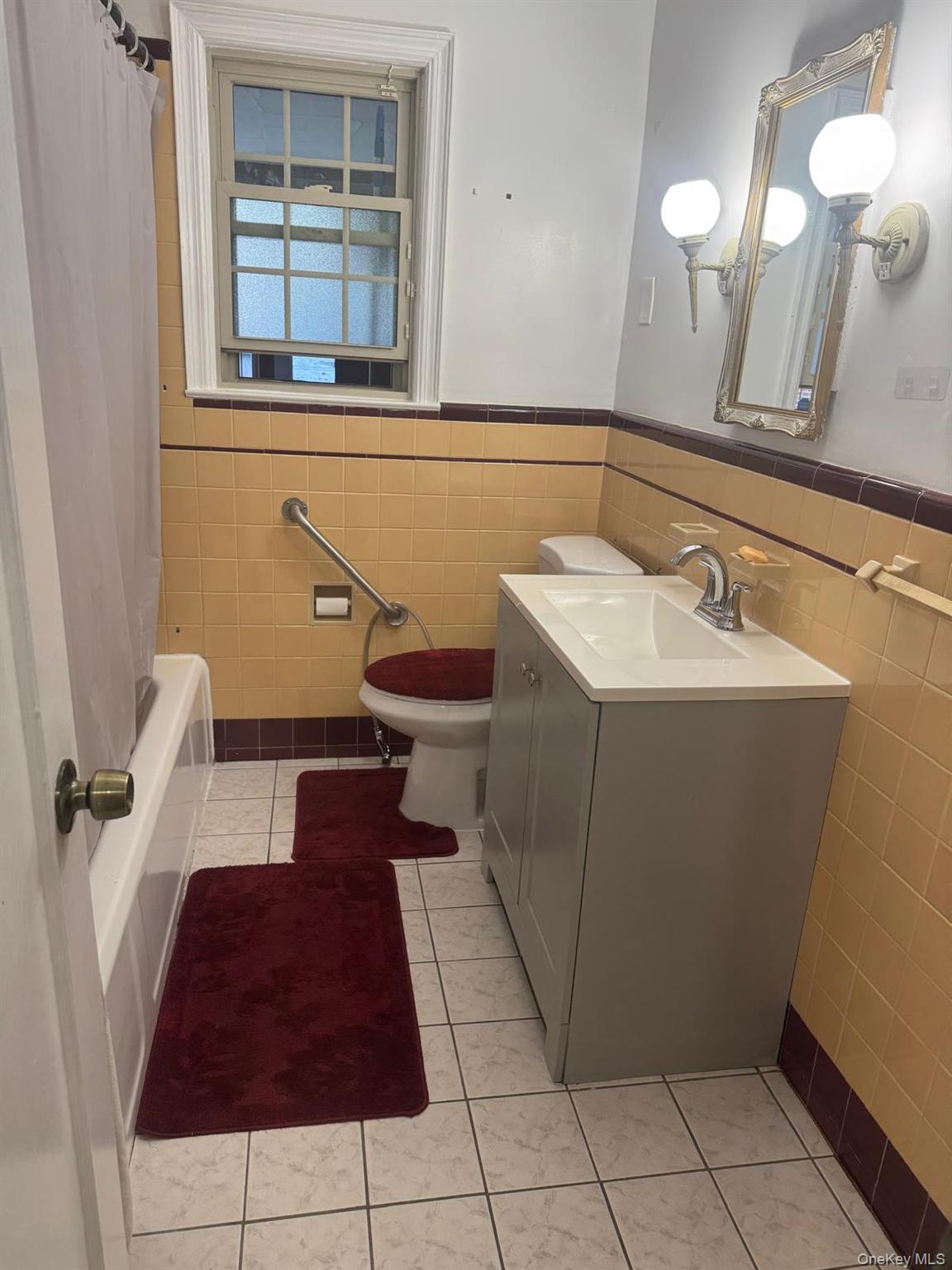 80-23 247th Street Queens, NY 11426 - Photo 3 of 19 a bathroom with a sink and a mirror