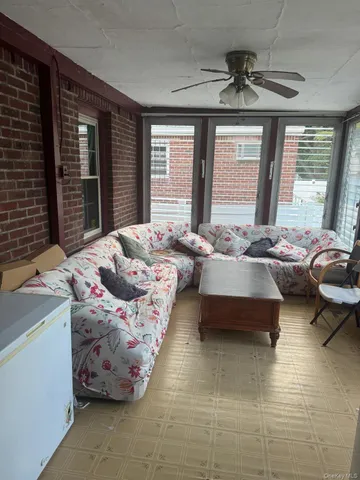 a spacious bedroom with a bed and wooden floor