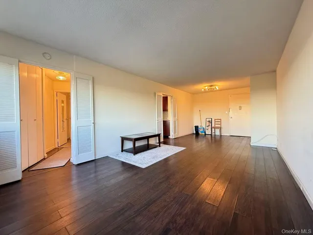 a view of a room with wooden floor water view and pool table