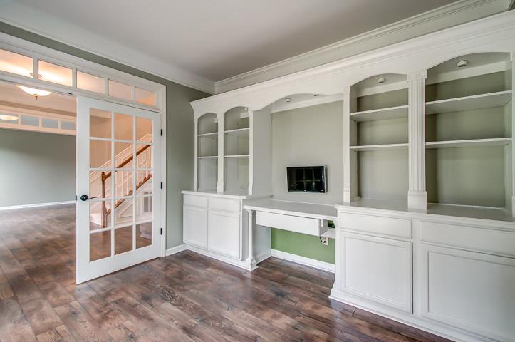 109 Chester Stevens Road Franklin, TN 37067 - Photo 4 of 30 a view of an empty room with a fireplace and a window