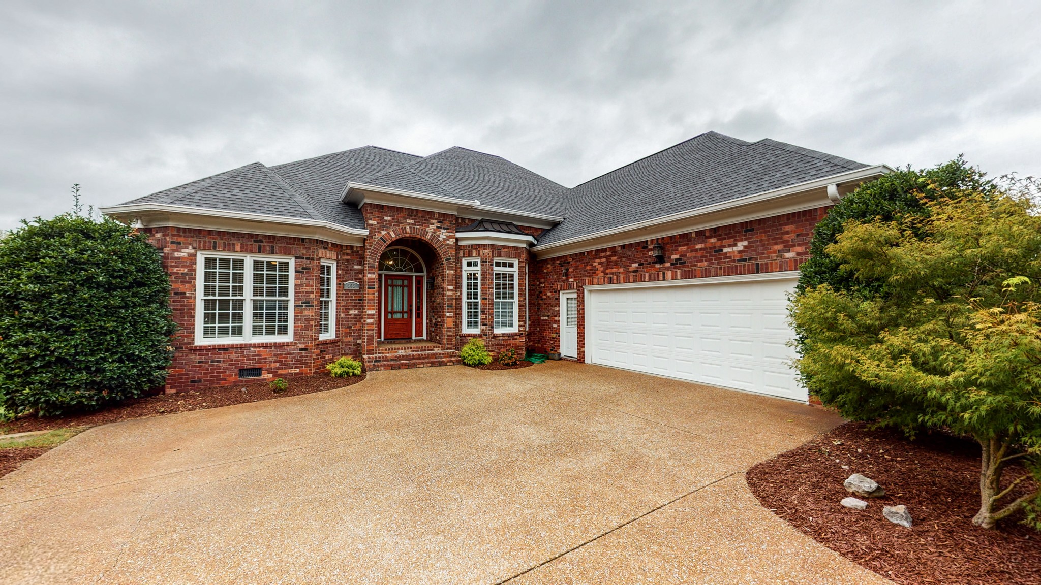 front view of a house with a patio