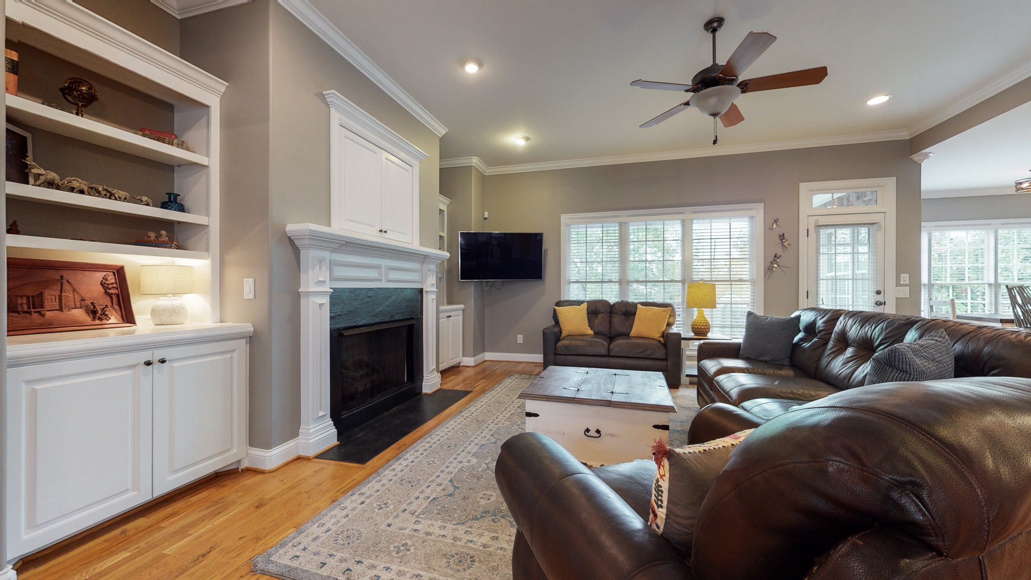 665 Springlake Drive Franklin, TN 37064 - Photo 11 of 41 a living room with furniture ceiling fan and a fireplace