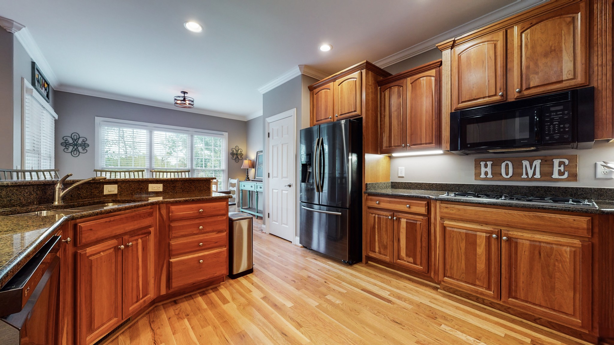665 Springlake Drive Franklin, TN 37064 - Photo 14 of 41 a kitchen with stainless steel appliances granite countertop a refrigerator stove and sink