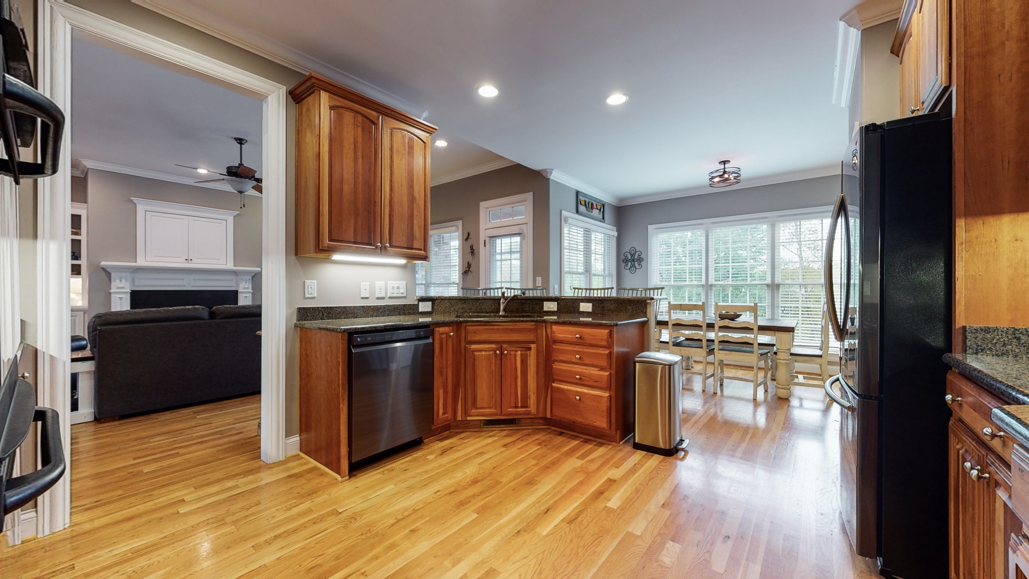 665 Springlake Drive Franklin, TN 37064 - Photo 15 of 41 a kitchen with granite countertop wooden floors and stainless steel appliances