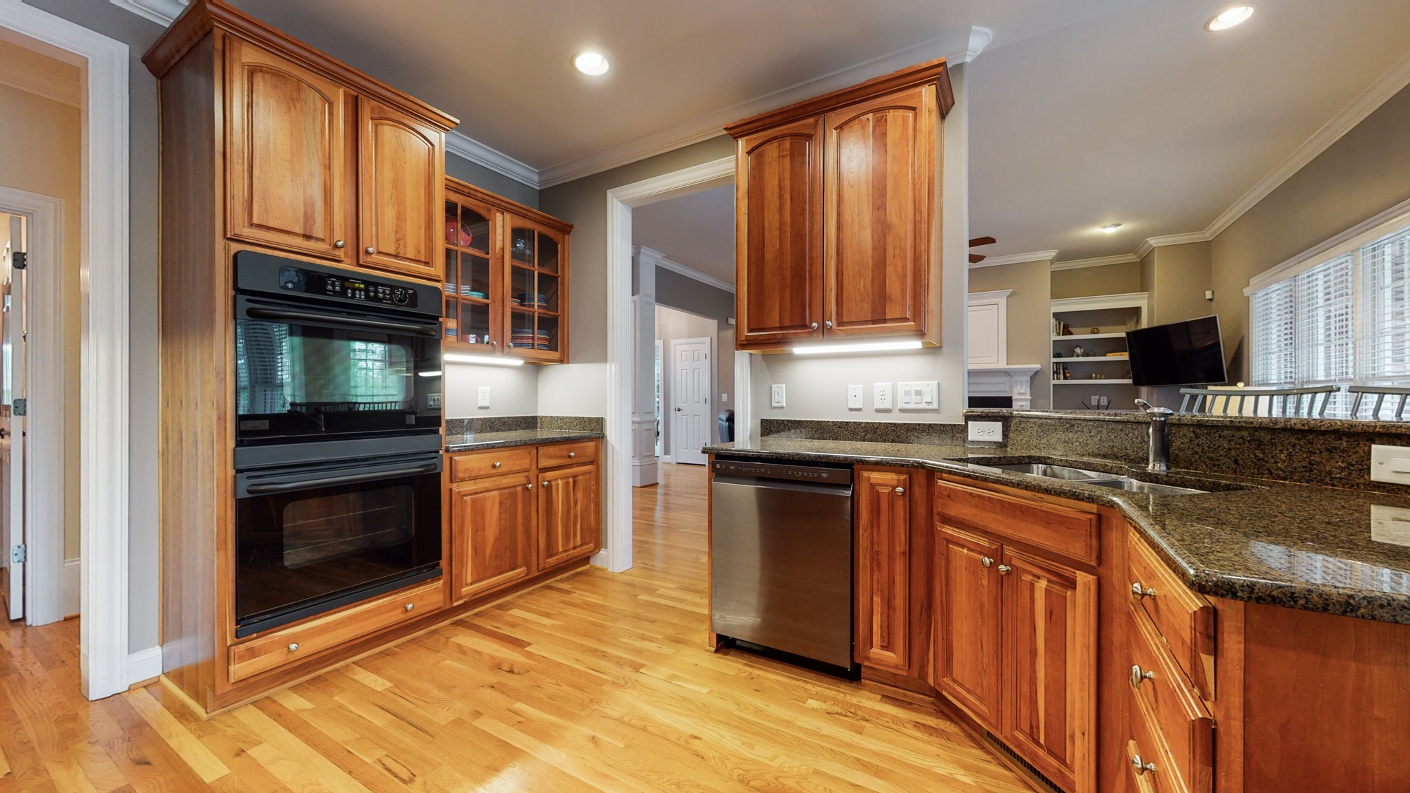 665 Springlake Drive Franklin, TN 37064 - Photo 16 of 41 a kitchen with granite countertop wooden cabinets stainless steel appliances and a granite counter tops