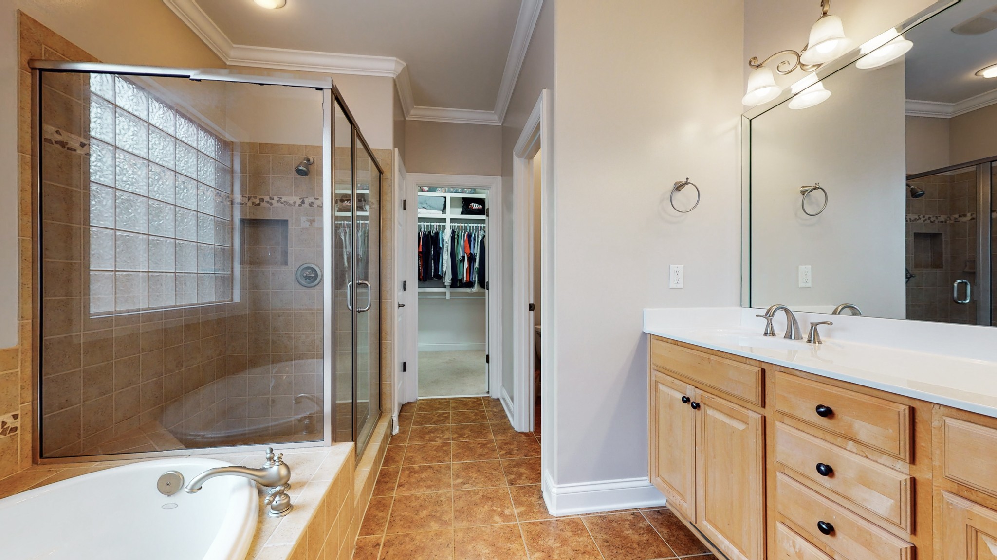 665 Springlake Drive Franklin, TN 37064 - Photo 23 of 41 a bathroom with a tub sink mirror and shower