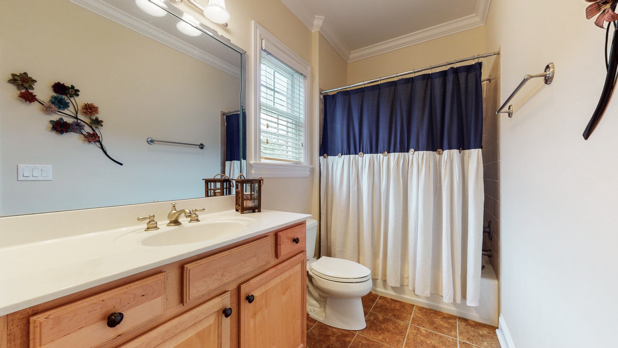 665 Springlake Drive Franklin, TN 37064 - Photo 26 of 41 a bathroom with a sink a toilet and a mirror