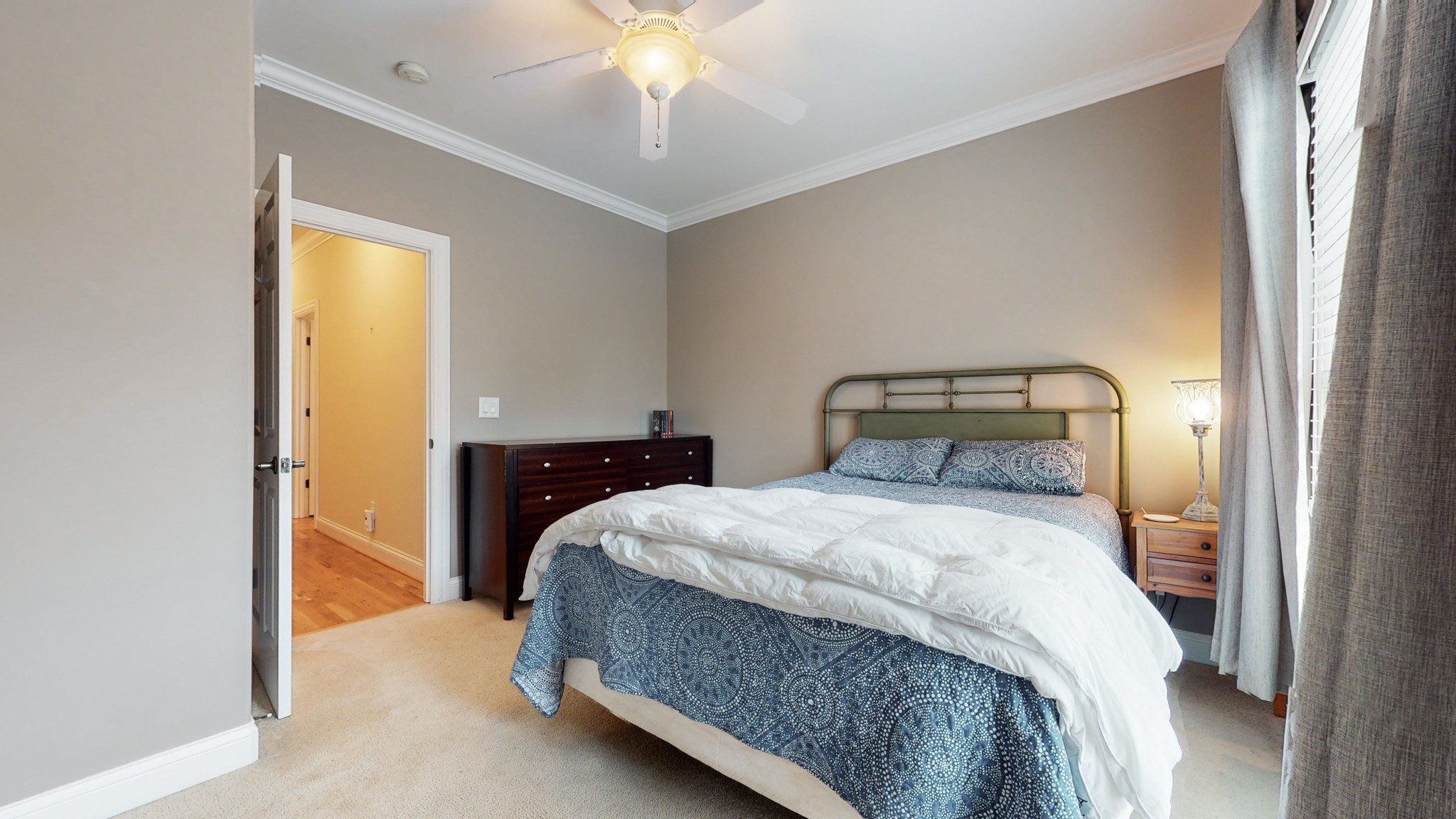 665 Springlake Drive Franklin, TN 37064 - Photo 28 of 41 a bedroom with a bed and a chandelier