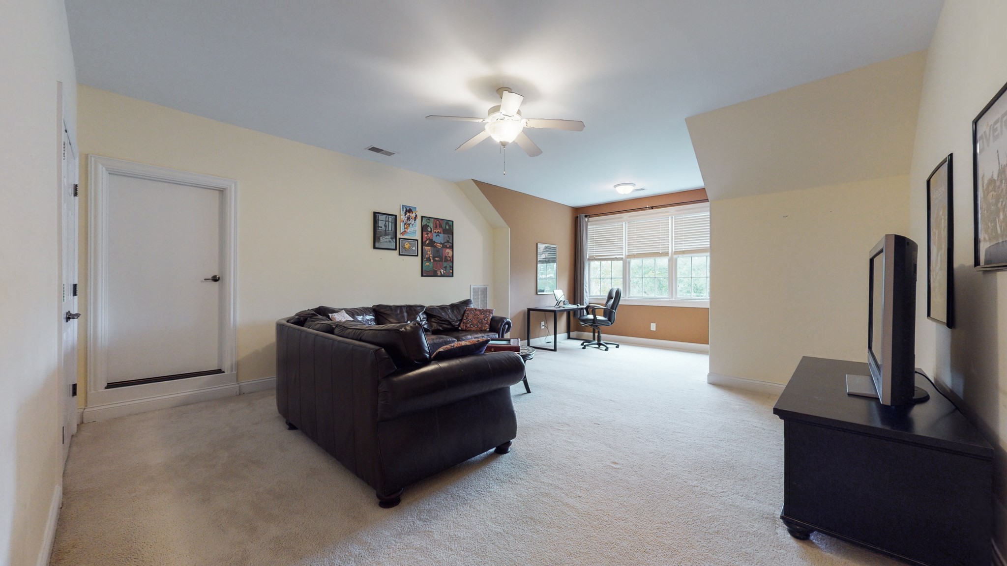 665 Springlake Drive Franklin, TN 37064 - Photo 29 of 41 a living room with furniture and a flat screen tv